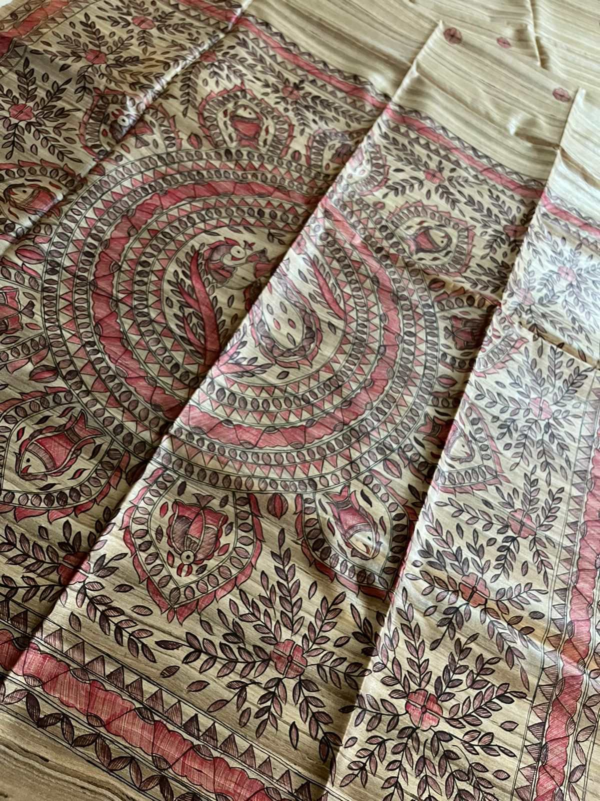 Handloom Pure Tussar Ghicha Silk Saree featuring handpainted Madhubani art on the anchal and border