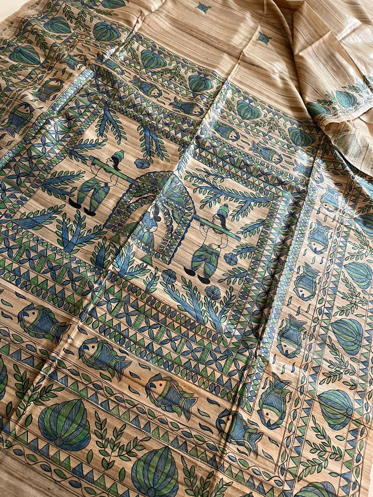 Handloom Pure Tussar Ghicha Silk Saree featuring handpainted Madhubani art on the anchal and border