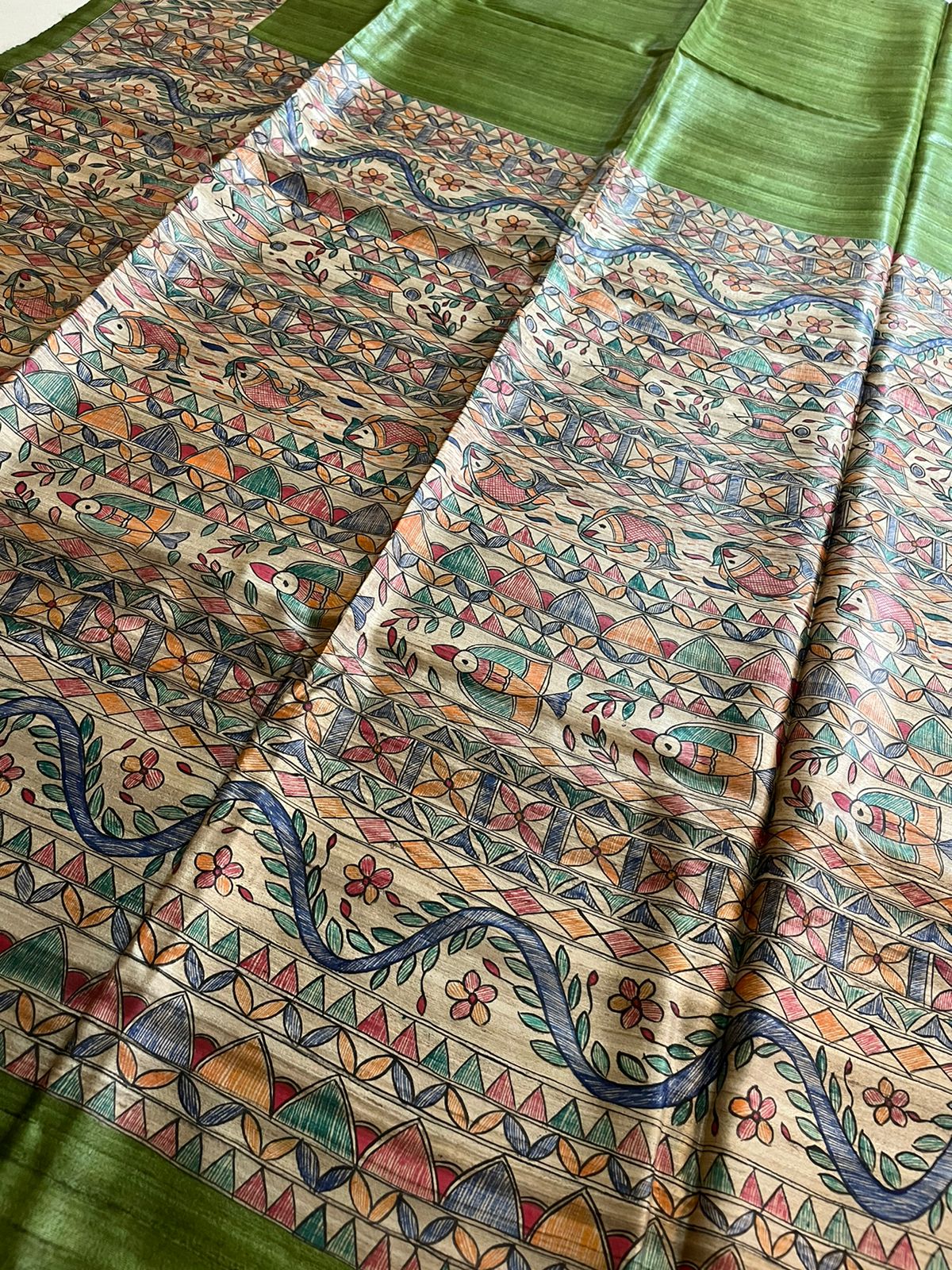 Handloom Pure Tussar Ghicha Silk Saree featuring handpainted Madhubani art on the anchal and border