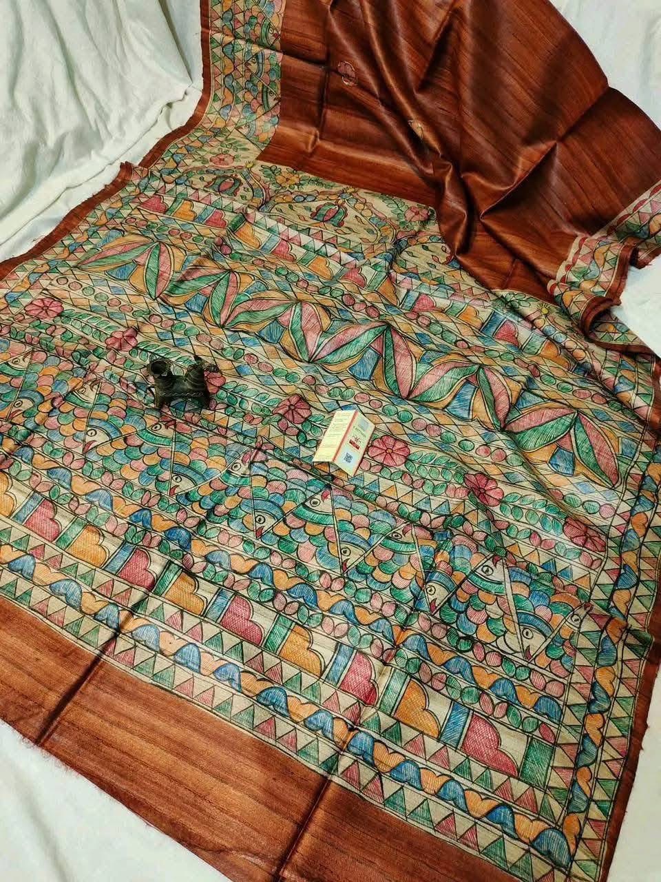 Handloom Pure Tussar Ghicha Silk Saree featuring handpainted Madhubani art on the anchal and border
