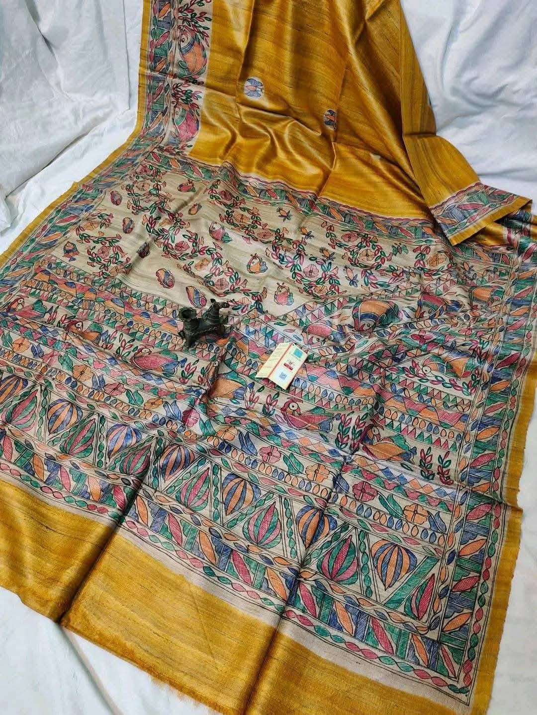 Handloom Pure Tussar Ghicha Silk Saree featuring handpainted Madhubani art on the anchal and border