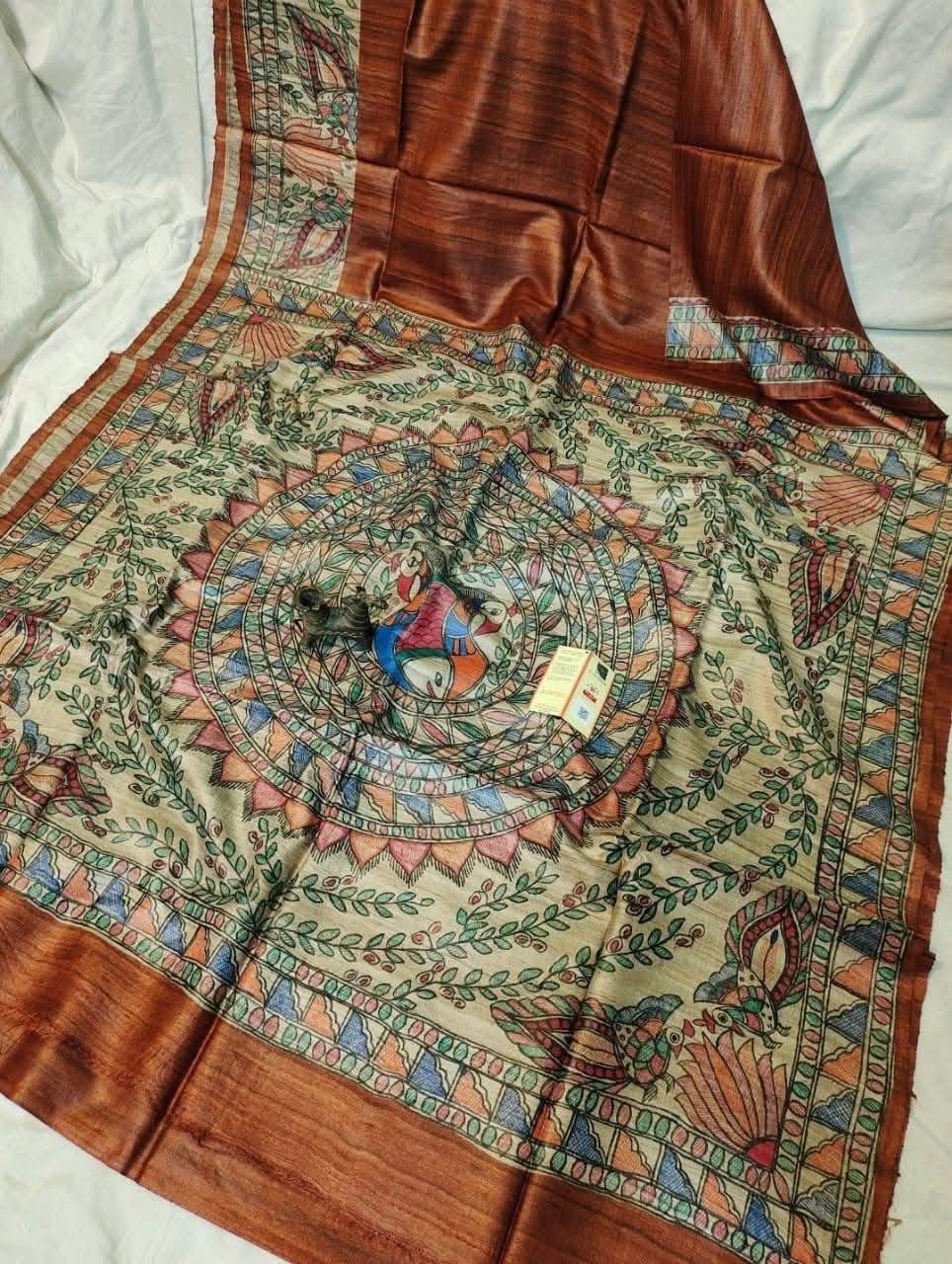 Handloom Pure Tussar Ghicha Silk Saree featuring handpainted Madhubani art on the anchal and border