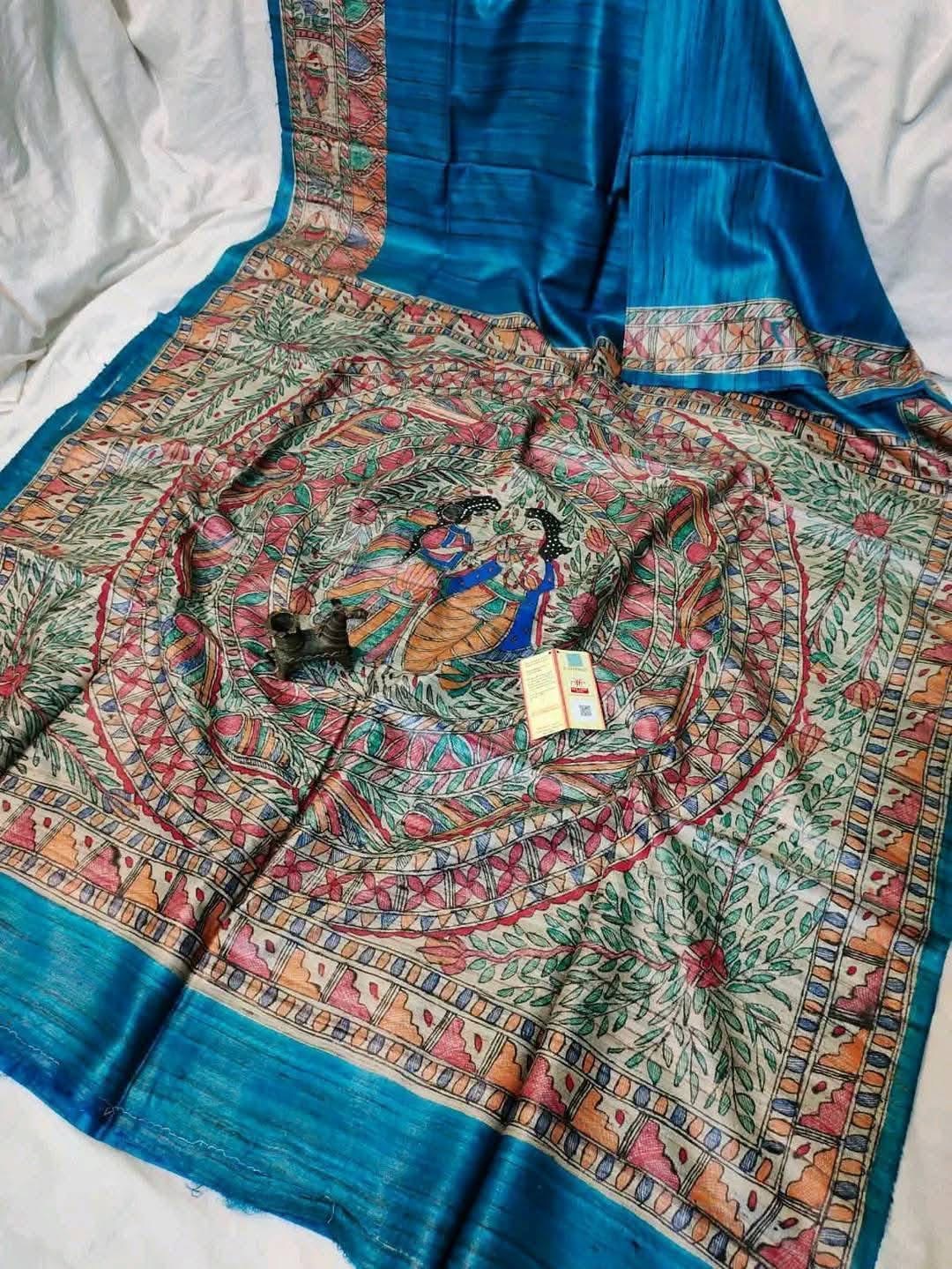 Handloom Pure Tussar Ghicha Silk Saree featuring handpainted Madhubani art on the anchal and border
