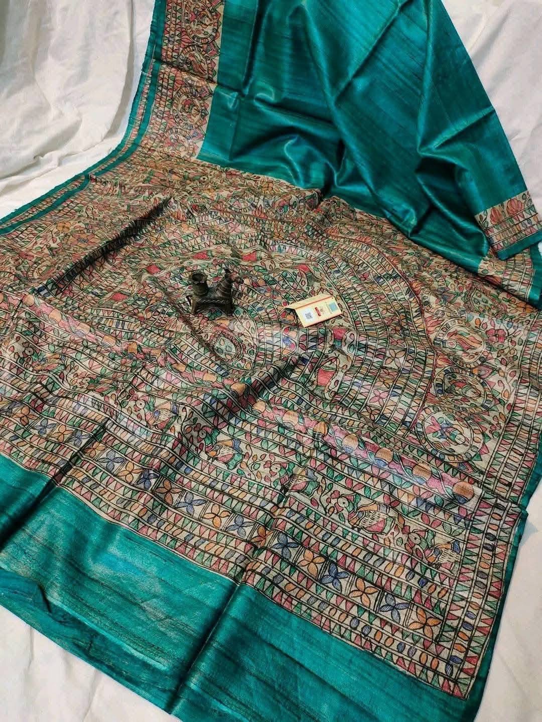 Handloom Pure Tussar Ghicha Silk Saree featuring handpainted Madhubani art on the anchal and border