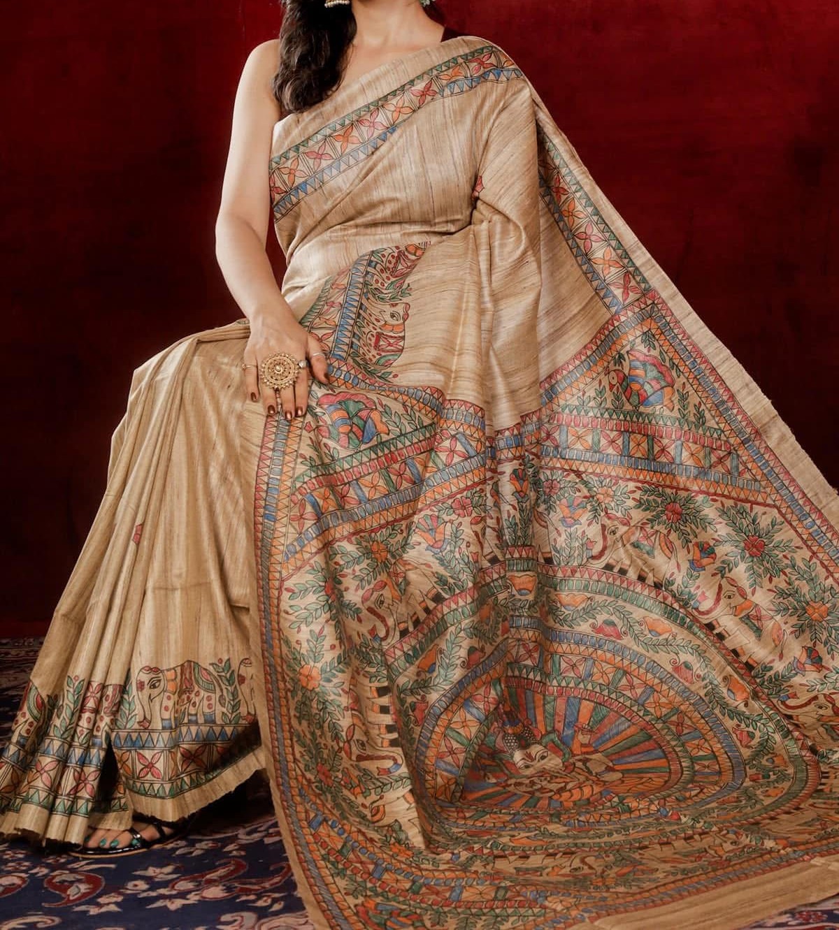 Handloom Pure Tussar Ghicha Silk Saree featuring handpainted Madhubani art on the anchal and border