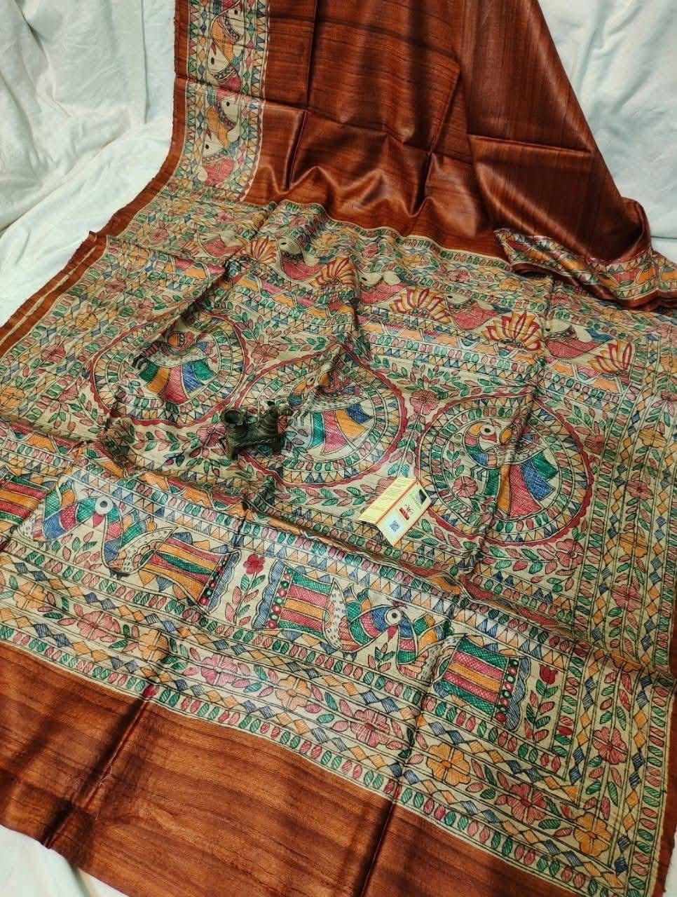 Handloom Pure Tussar Ghicha Silk Saree featuring handpainted Madhubani art on the anchal and border