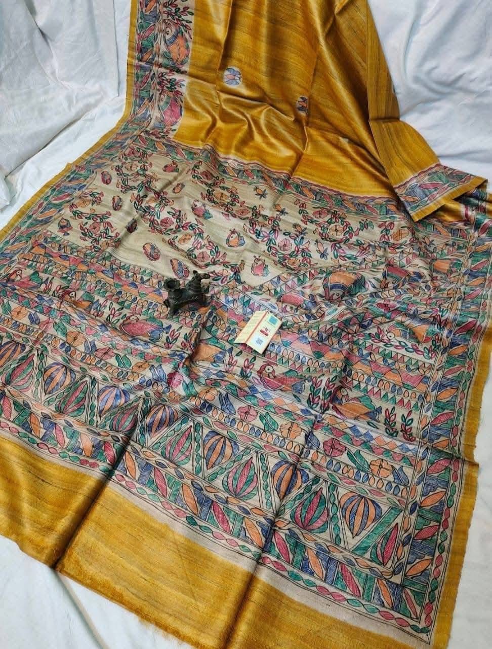 Handloom Pure Tussar Ghicha Silk Saree featuring handpainted Madhubani art on the anchal and border