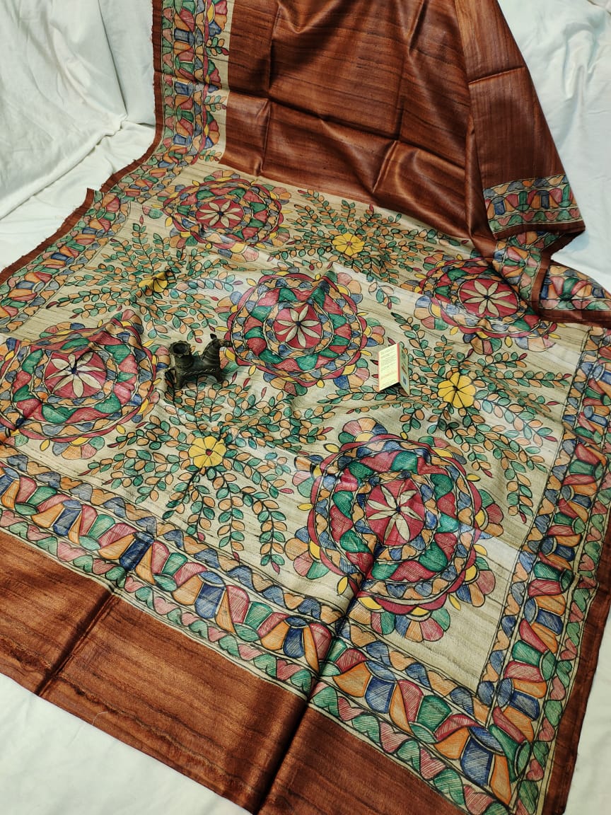 Handloom Pure Tussar Ghicha Silk Saree featuring handpainted Madhubani art on the anchal and border
